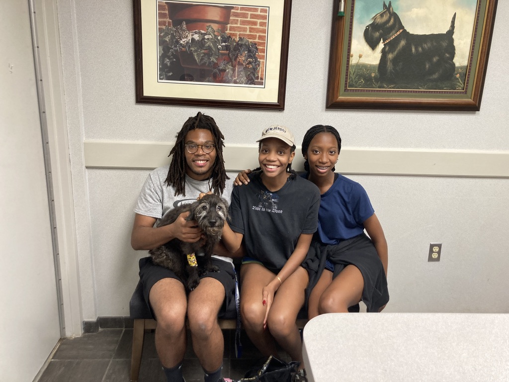 Christen with friends and a dog